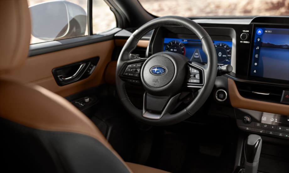 Interior view of the 2026 Subaru Outback showing the driver display and infotainment system supporting Highway Hands-Free Assist and advanced EyeSight driver-assistance features.