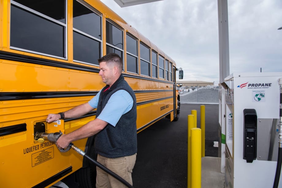 a school bus refuels at a propane station