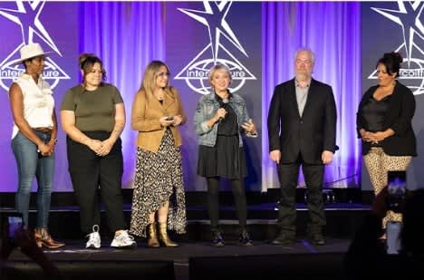 Teachers on stage at last year's Intercoiffure