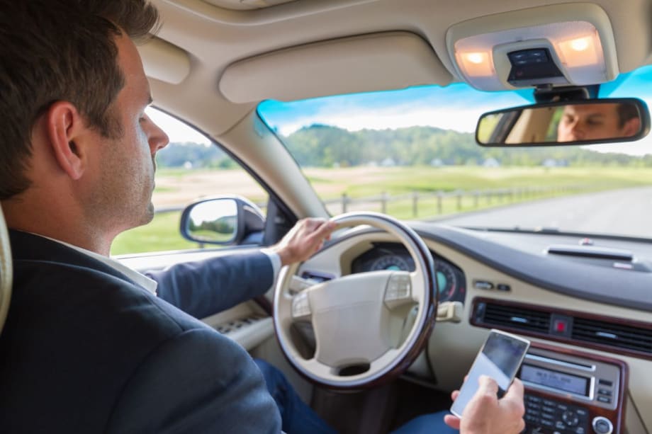 Total Bans on Cellphone Use Behind the Wheel Curtail Crashes