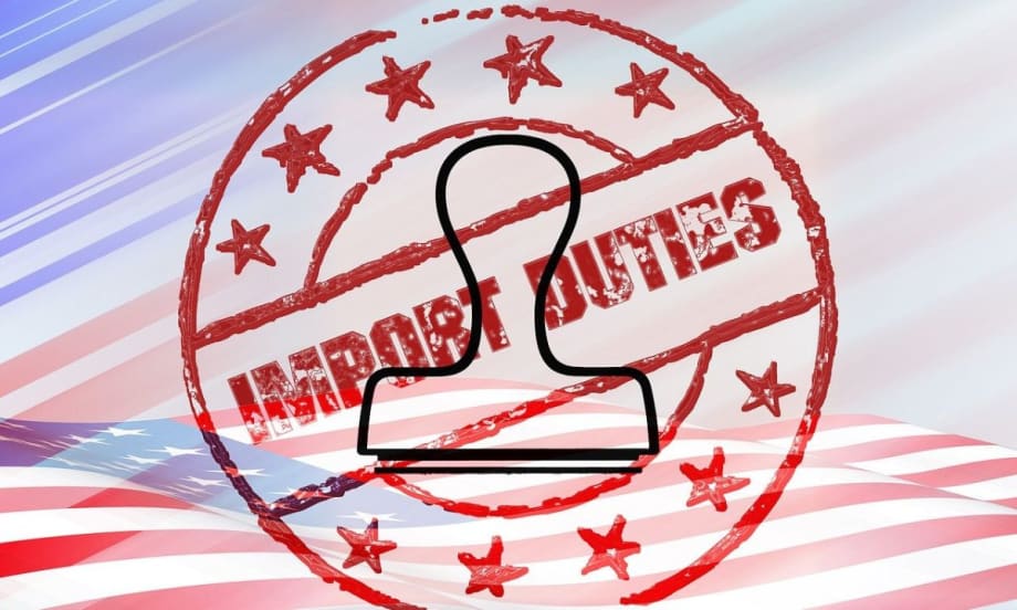 An import duties stamp and stamper superimposed on a flat American flag.