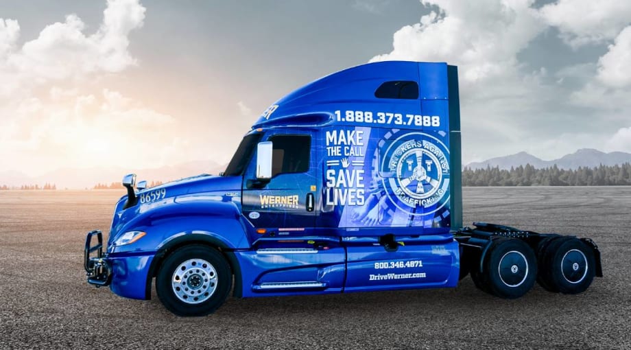 Blue Werner heavy-duty truck tractor with TAT human trafficking prevention wrap
