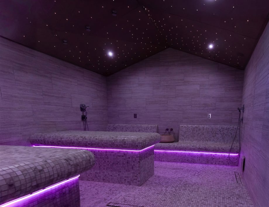 A dimly lit room resembles twilight in Excuria's Turkish Bath Room.