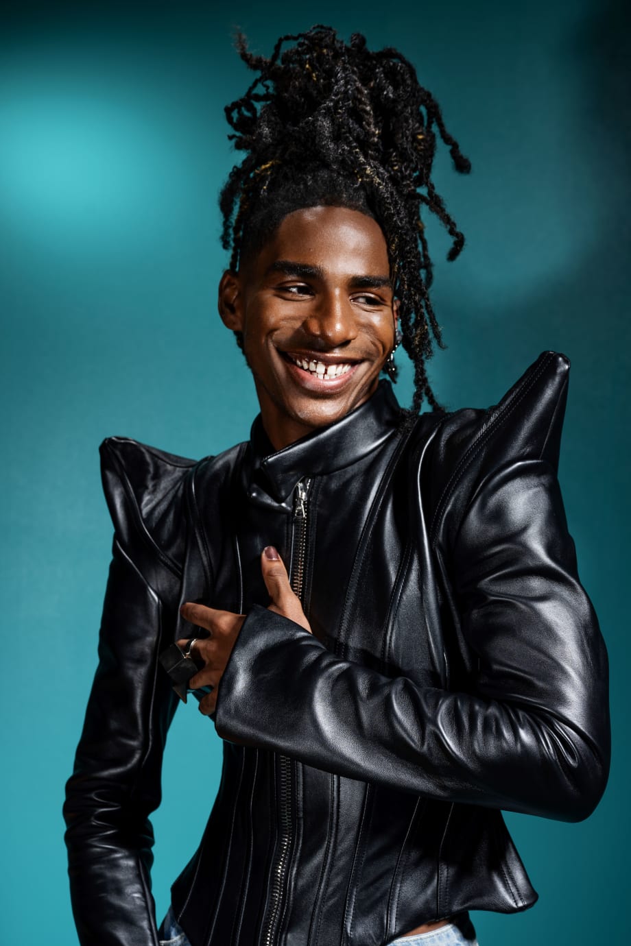 A Black male model with locs.