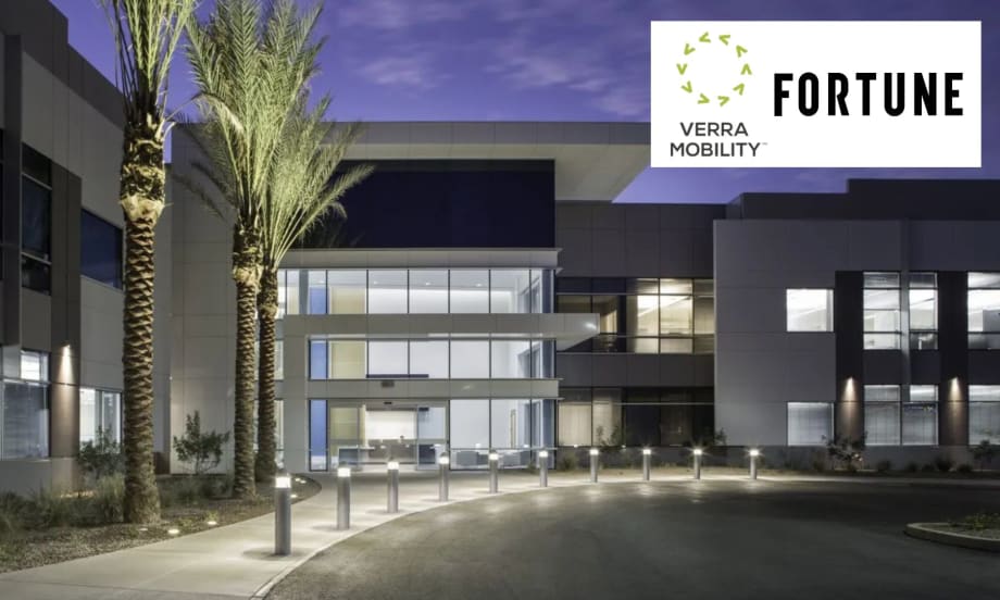 the exterior of an office building with two logos