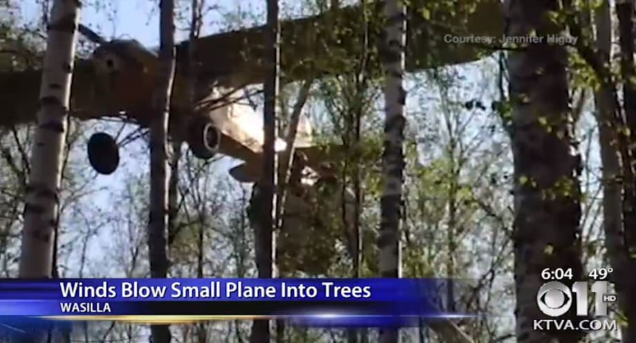 Utilities Use Trucks to Rescue Pilot, Man Stuck in Trees