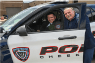 Officer smiling with an executive