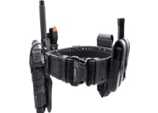 A close up of a police holster with assorted pockets for officers' equipment.