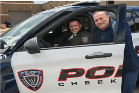 Officer smiling with an executive